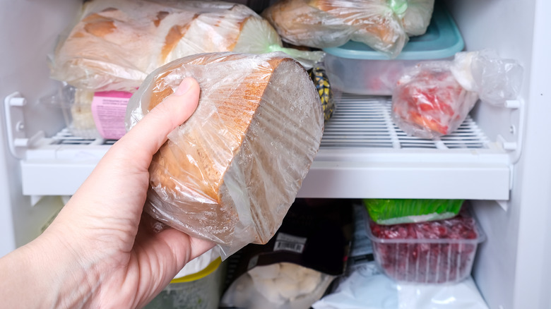 Person holding frozen bread