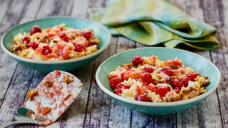 cherry pineapple dump cake in teal bowls