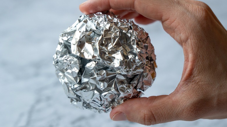 A ball of crinkled aluminum foil