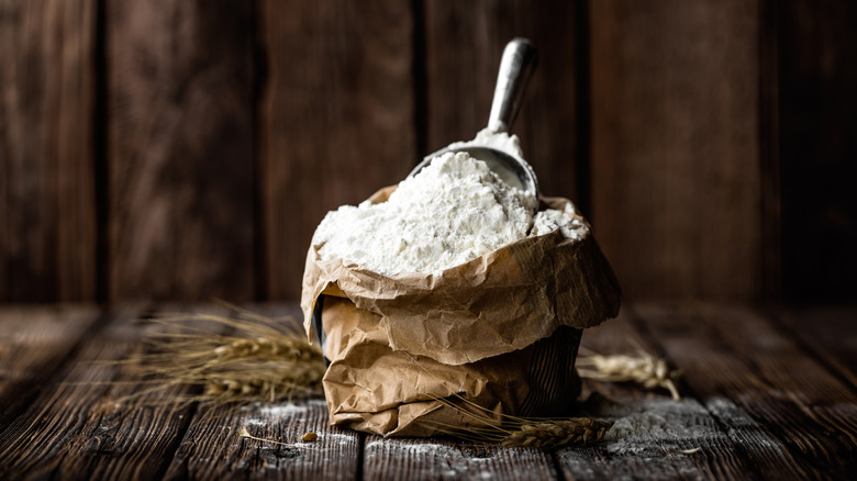 A bag of flour with scoop