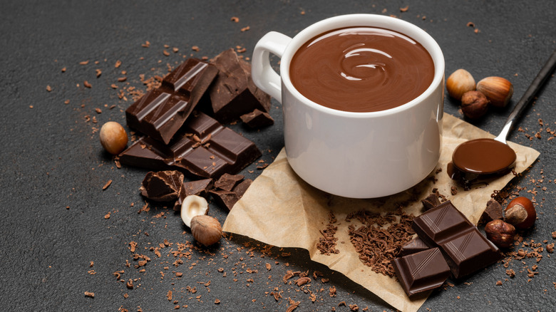 A cup of hot chocolate with chocolate bars
