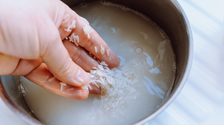 Person rinsing rice