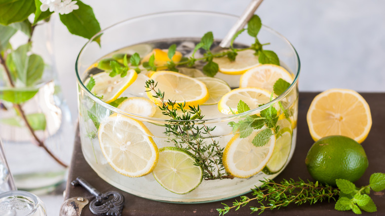 Punch bowl with citrus and herbs