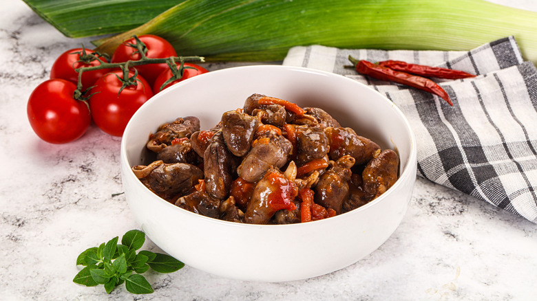 Baked chicken hearts in a bowl