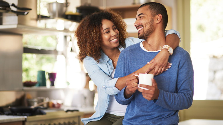 Smiling young couple at home
