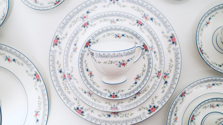 Stacked dishes and teacup from a floral pattern china set