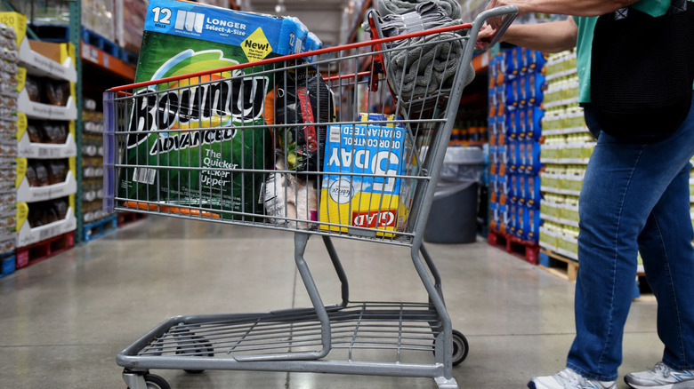 Person pushing costco shopping trolley