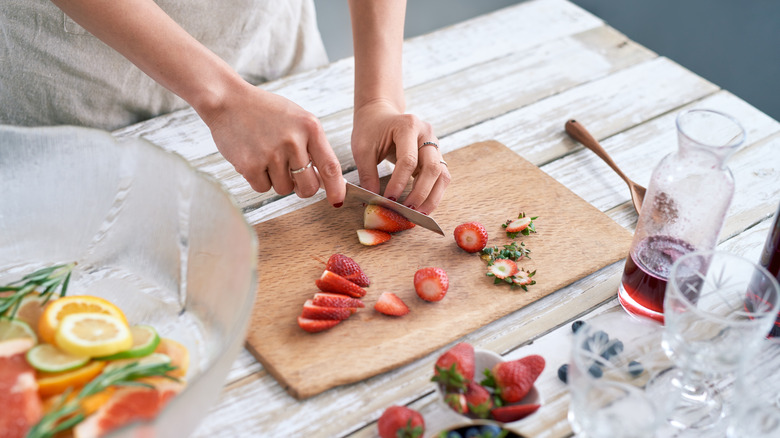 Batch making punch with fruit