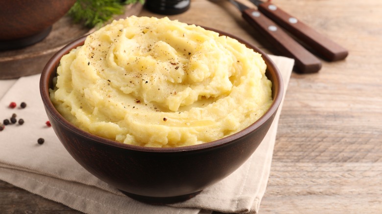Wooden bowl with mashed potatoes