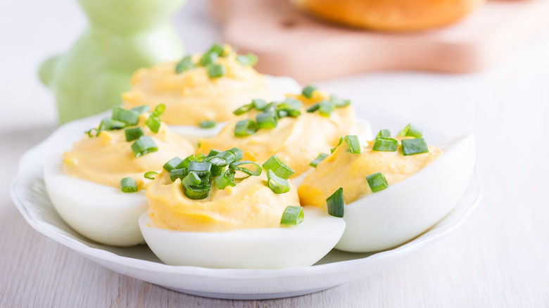 Plate of deviled eggs with creamy filling
