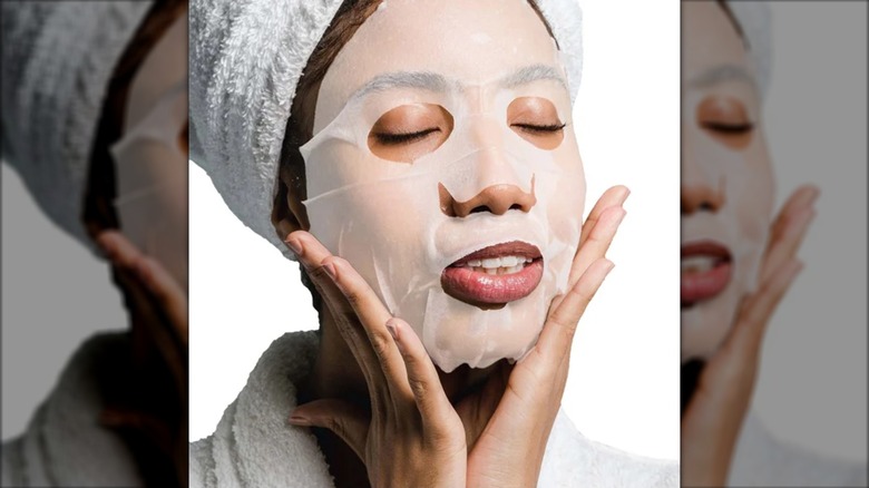 Someone wears a Discover NIGHT Hydrating Silk Hyaluronic Acid Sheet Mask