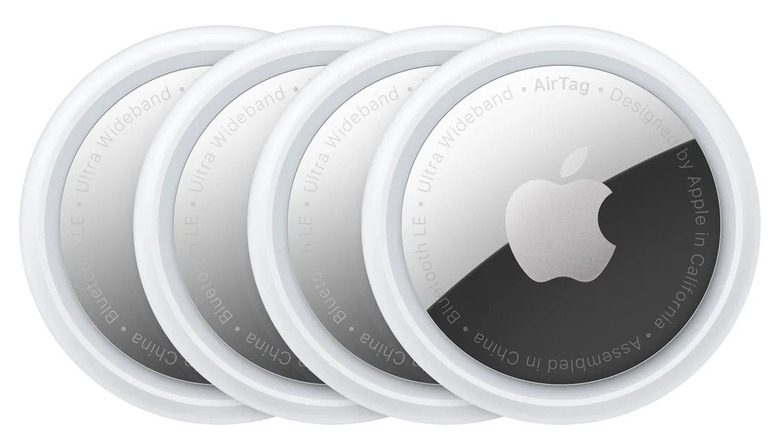 Closeup image of four Apple AirTags lined up and overlapping