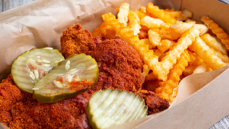 Dave's Hot Chicken, fries and pickle.
