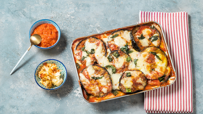 Eggplant Parmesan with sauce and cauliflower on the side