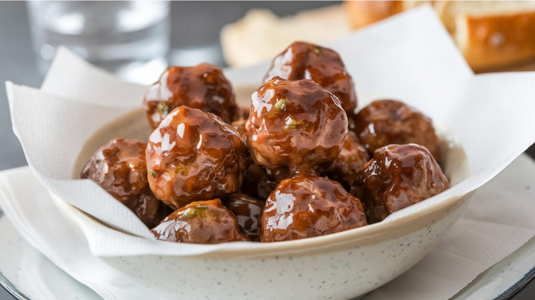 Bowl of cooked meatballs glazed in sauce
