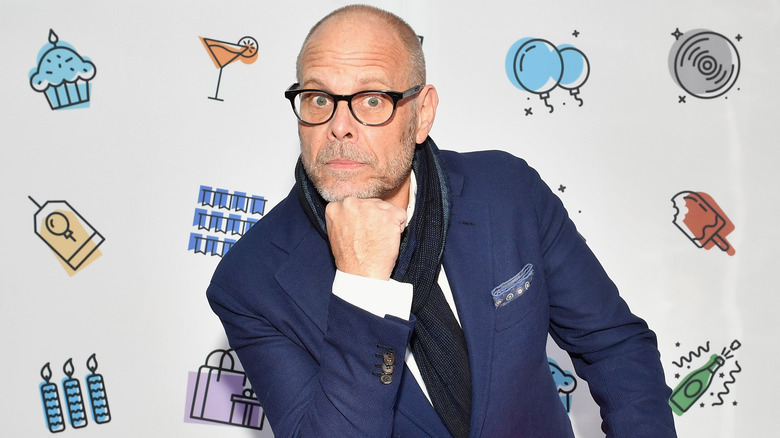 Alton Brown poses at a Food Network holiday appearance.