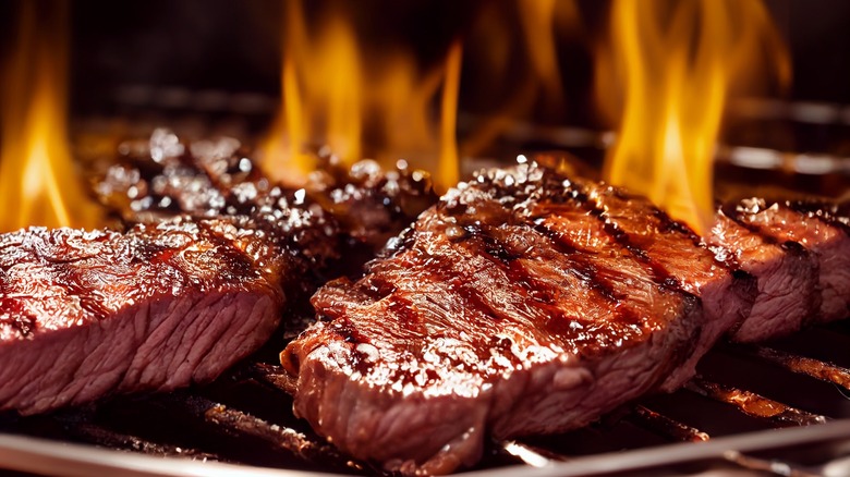 steak cooking on grill