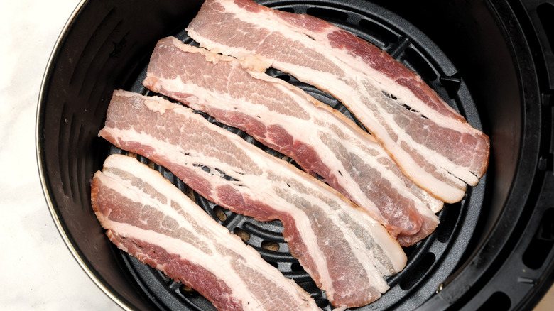 Slices of raw bacon in the air fryer