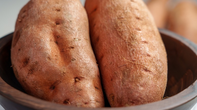 Close up raw sweet potatoes