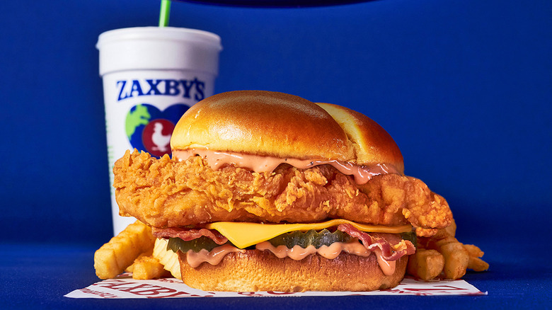 A chicken club sandwich from Zaxby's sits on its wrapper