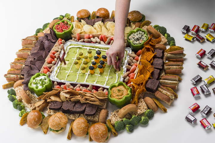 Add the football players and goalposts