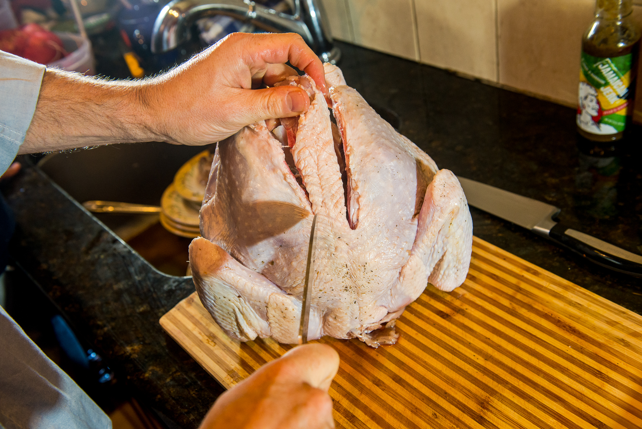 Rinse turkey, remove backbone