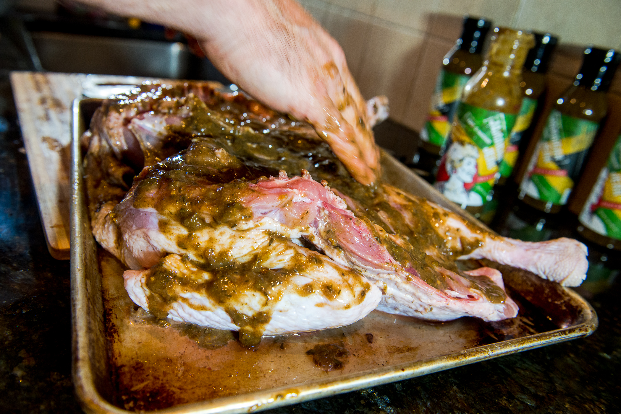Coat the inside with jerk sauce and allow to marinate