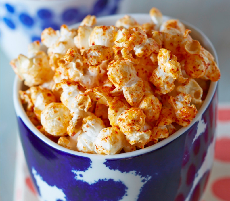 Popcorn coated with a mix of butter, mayo, lime juice and spices makes