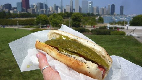 Putting ketchup on hot dogs
